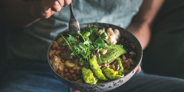 Empowered woman enjoying a plant-based meal.